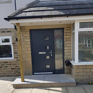 a house with a black front door and windows