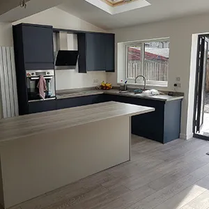 a kitchen with a skylight in the middle of it