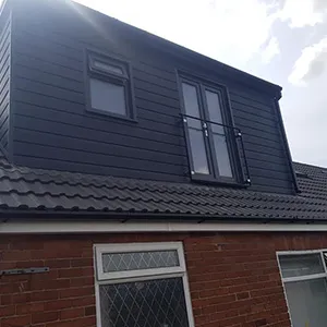 a house with a black roof and windows