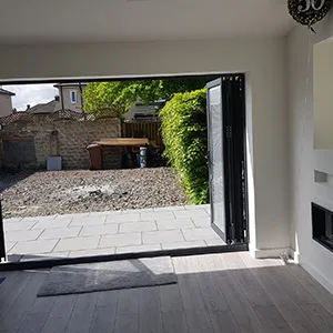 a living room with a large sliding glass door